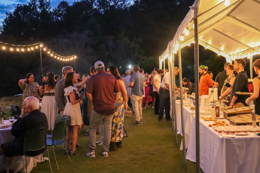 Guests mingle and enjoy food from local restaurants in the Flower Garden